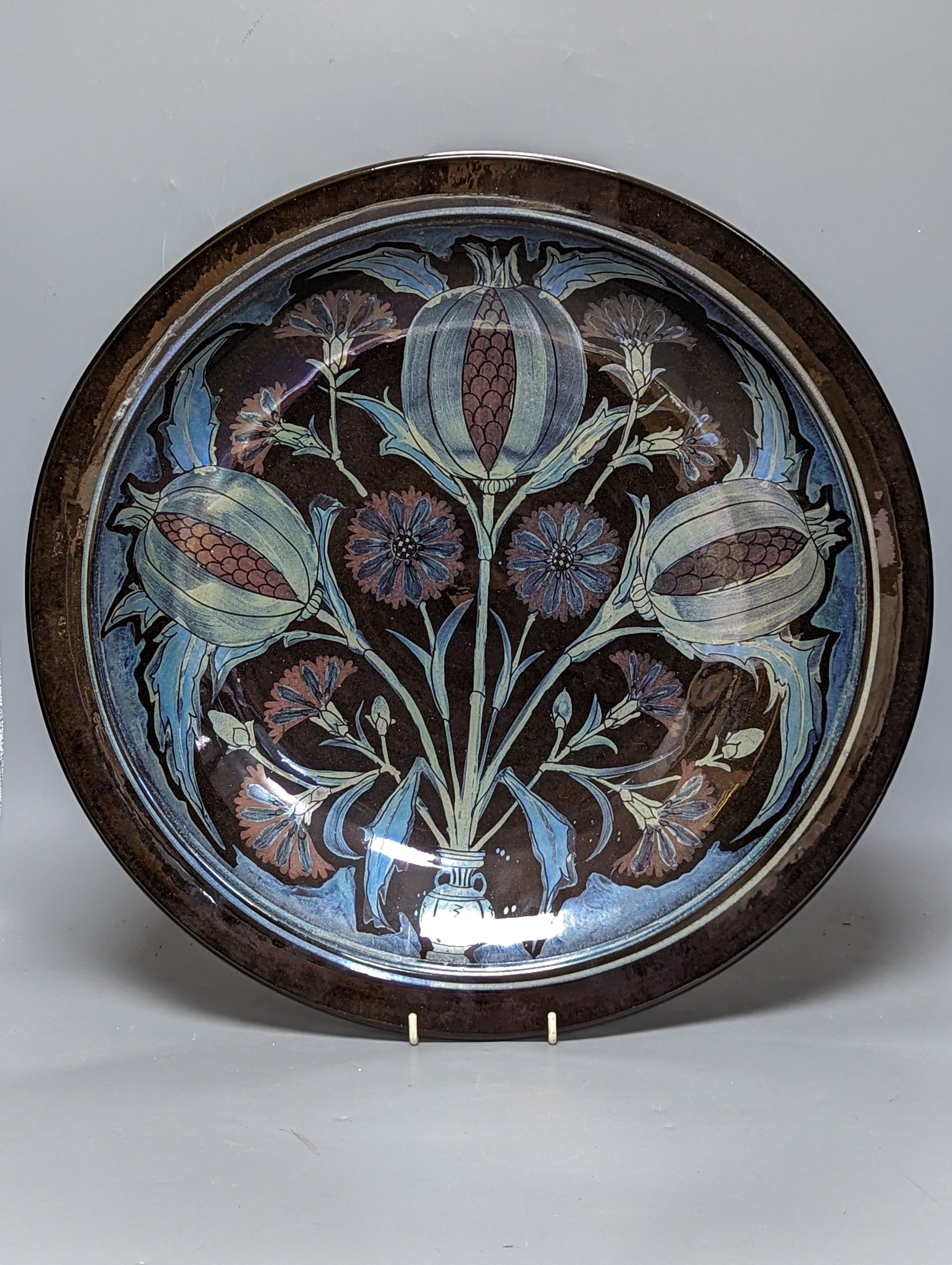Jonathan Chiswell-Jones. A pomegranate pattern reduction fired lustre charger, numbered 4232, diameter 44cm